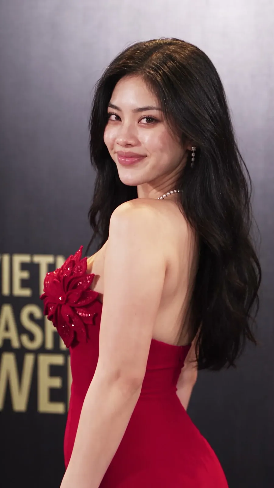 Melody in a red gown at Vietnam Fashion Week